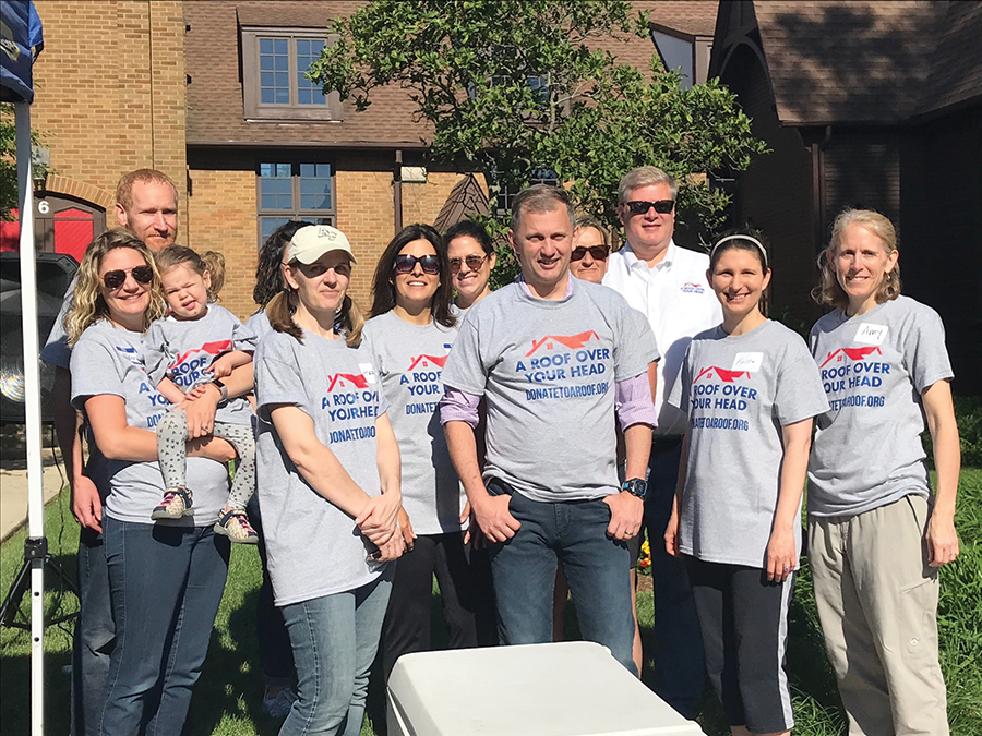 NRCA staff and Showalter Roofing Service staff joined Congressman Sean Casten (center) for a community service project in Wheaton, Ill.